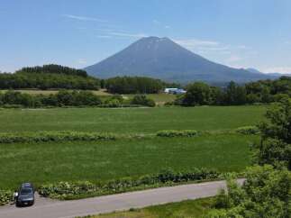 Discover breathtaking natural beauty with this stunning property offering panoramic views of a majestic mountain.