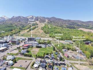 Discover prime real estate opportunities in Furano, Japan, with this aerial view showcasing the Kitanomine Gondola and Fenix Furano ski areas.