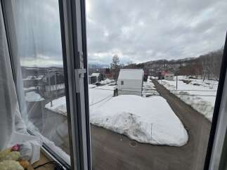 Experience the charm of a winter wonderland from this unique property, offering picturesque views of snow-covered landscapes and cozy homes.