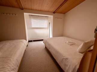This charming room features two comfortable beds, perfect for accommodating guests or family.
