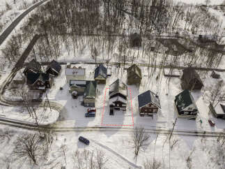 Discover this charming property nestled in a serene, snowy landscape, perfect for a winter retreat.