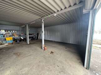 Explore this spacious storage unit, perfect for your vehicles or extra belongings.
