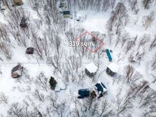 Discover this unique property nestled in a serene, snow-covered landscape, perfect for a secluded getaway.