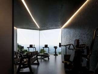 Experience luxury fitness with this state-of-the-art home gym, featuring panoramic views of the stunning landscape.