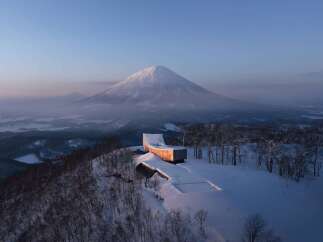 Experience unparalleled luxury in this modern architectural marvel nestled on a snow-covered mountainside.