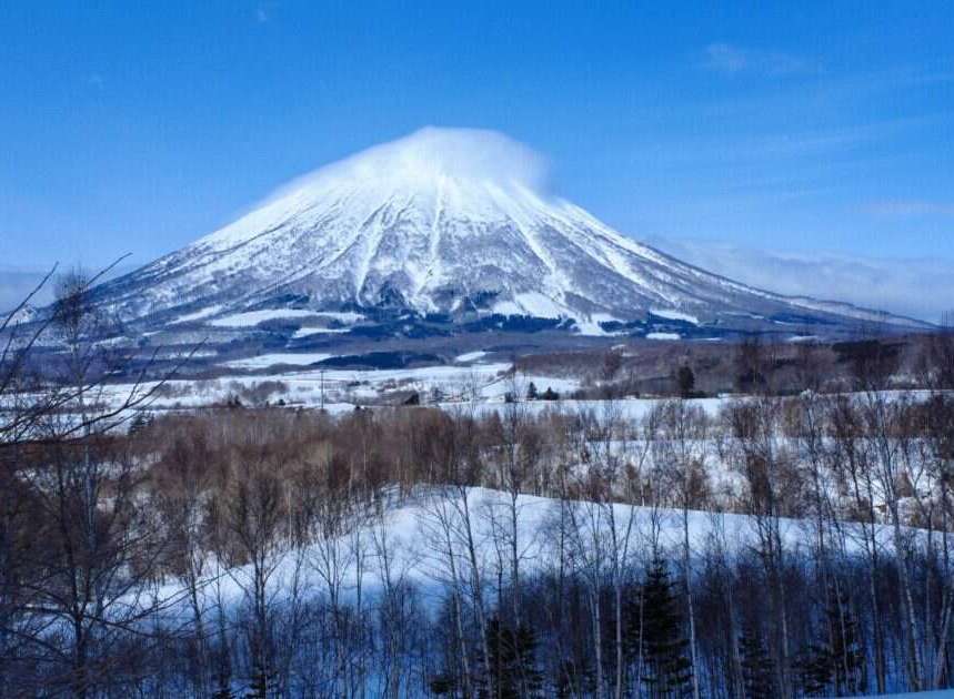 Experience the serene beauty of a snow-capped mountain vista, perfect for a tranquil retreat.