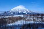 Experience the serene beauty of a snow-capped mountain vista, perfect for a tranquil retreat.