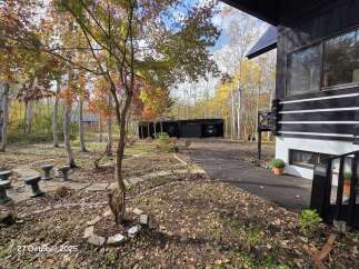 Experience the beauty of autumn at this unique property, nestled amidst vibrant fall foliage.