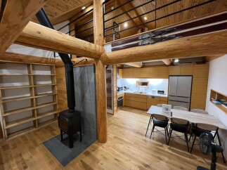 Experience rustic charm and modern convenience in this unique log cabin-style home.