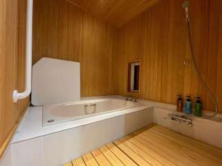 Experience ultimate relaxation in this luxurious bathroom featuring a deep soaking tub and a separate shower area.
