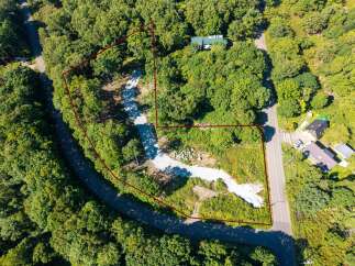 Discover this expansive wooded lot, perfect for building your dream home or a private retreat.
