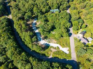 Discover this expansive wooded lot, perfect for building your dream home or a private retreat.