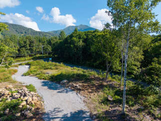 Discover this stunning property nestled amidst lush greenery and rolling hills, offering a serene escape.