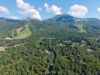 Discover this prime location nestled amidst lush greenery, offering breathtaking mountain views and proximity to recreational activities.