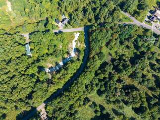 Discover this prime parcel of land nestled amidst lush greenery, offering a serene escape.
