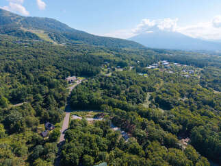 Discover this stunning property nestled amidst lush greenery, offering a serene escape with breathtaking mountain views.