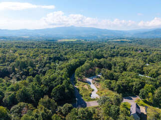 Discover this expansive wooded lot, perfect for building your dream home or a private retreat.