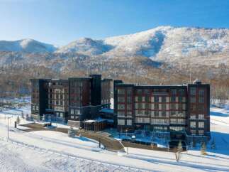 Experience luxury mountain living in this stunning resort property, nestled amidst snow-covered peaks and pristine winter landscapes.