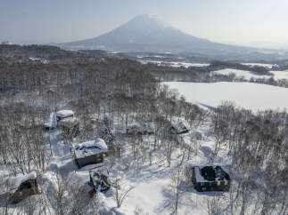 Discover your dream winter escape with this stunning property nestled amidst snow-covered trees, offering breathtaking views of Mount Yotei.
