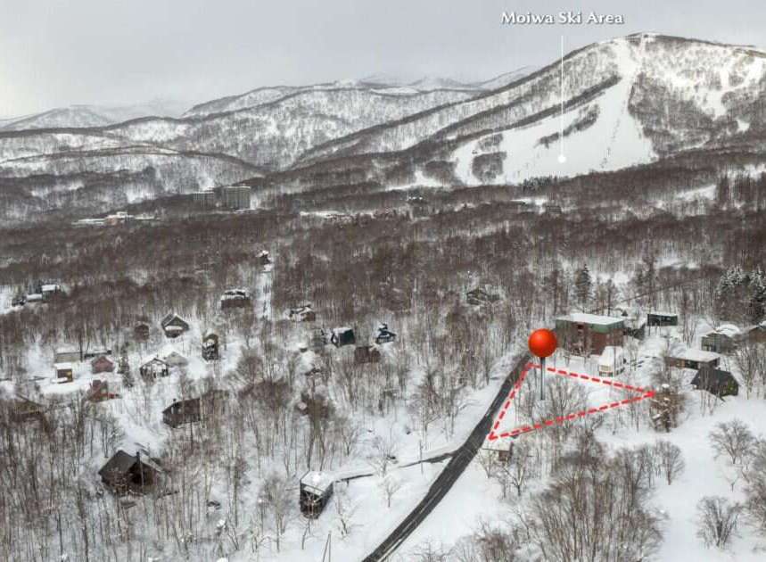 Discover your dream winter getaway in this charming ski resort village, nestled amongst snow-covered trees.