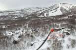 Discover your dream winter getaway in this charming ski resort village, nestled amongst snow-covered trees.