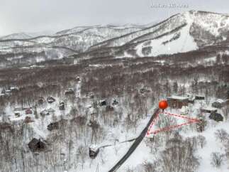 Discover your dream winter getaway in this charming ski resort village, nestled amongst snow-covered trees.