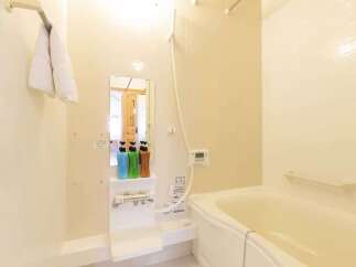 This bathroom features a clean and modern design with a spacious bathtub perfect for relaxation.