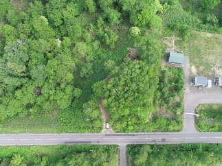 Discover this unique property nestled amidst lush greenery, offering a serene escape.