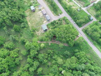 Discover this charming property nestled amidst lush greenery, offering a serene escape.
