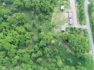 Discover this unique property nestled amidst lush greenery, offering a serene escape.