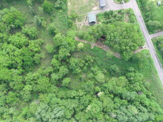 Discover this unique property nestled amidst lush greenery, offering a serene escape.