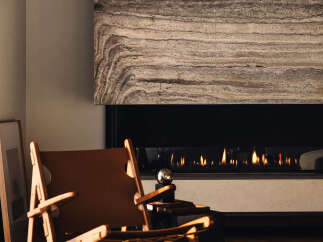 Experience modern luxury with this stunning living space, featuring a sleek gas fireplace as the centerpiece.