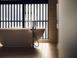 Experience ultimate relaxation in this luxurious bathroom featuring a freestanding soaking tub.