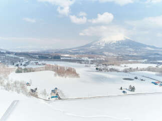 Experience the serene beauty of a winter wonderland with this stunning property nestled amidst snow-covered landscapes.