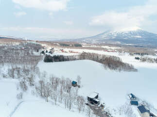 Experience the serene beauty of a winter wonderland with this stunning property nestled amidst snow-covered landscapes.