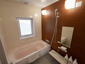 Discover comfort and convenience in this well-appointed bathroom, featuring a relaxing bathtub perfect for unwinding after a long day.