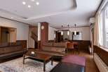 Experience comfort and style in this spacious living area, featuring plush leather sofas perfect for relaxation.