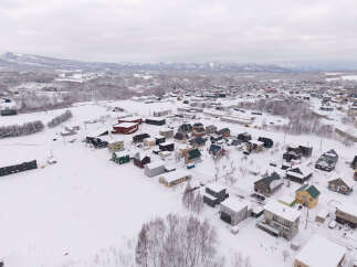 Discover this charming winter village nestled amidst snow-covered landscapes and majestic mountains.