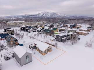 Discover this charming property nestled in a serene, snow-covered landscape, perfect for a winter getaway.