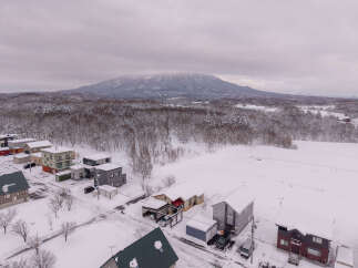 Experience the charm of a winter wonderland with this picturesque property nestled amidst snow-covered landscapes.