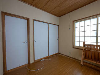 This room features traditional Japanese shoji doors, offering a serene and minimalist aesthetic.