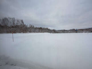 Discover this serene winter landscape, perfect for a peaceful retreat or a unique real estate opportunity.