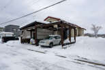 Experience the charm of winter living in this picturesque property, featuring a covered carport perfect for protecting your vehicles from the snow.