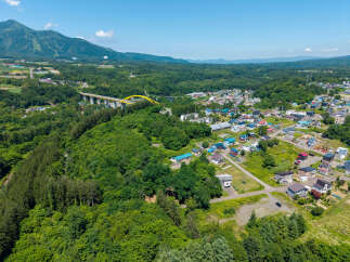 Discover this charming residential area nestled amidst lush greenery and rolling hills, offering a serene mountain backdrop.