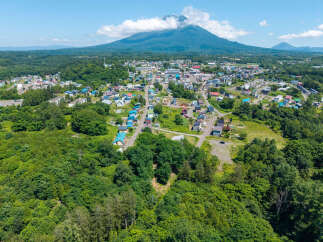 Discover this charming town nestled at the foot of a majestic mountain, offering a serene lifestyle with breathtaking natural beauty.