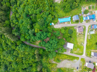 Discover this charming property nestled amidst lush greenery, offering a serene escape.