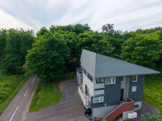 Discover this modern home nestled amidst lush greenery, offering a serene escape.