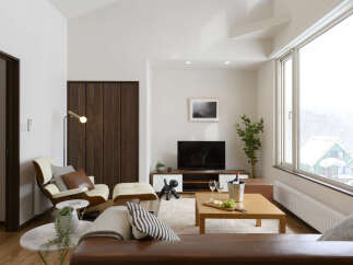 Experience modern living in this stylish apartment, featuring a comfortable living area with a sleek entertainment center and a cozy reading nook.