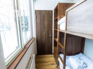 Experience cozy and efficient living with this well-designed bunk bed unit, perfect for maximizing space in a shared room.
