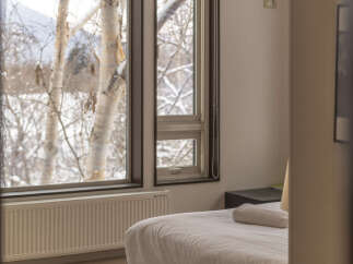 Experience cozy winter mornings with stunning views of snow-covered trees right outside your window.